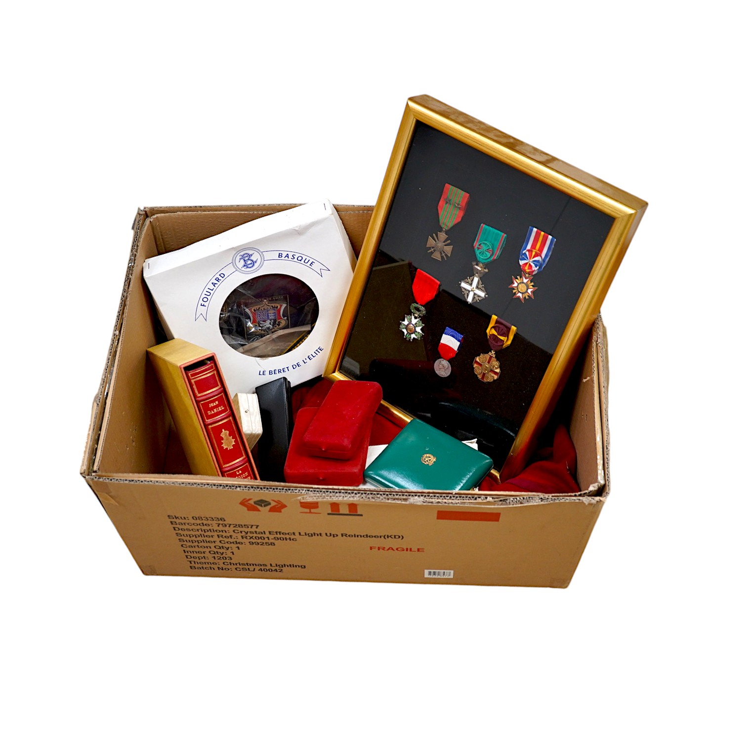 A framed medal group; Legion D'Honneur France, a British Cross, Italian order of Merit and Croix De Guerre with related book; La Legion d’Honneur by Jean Daniel, plus some related paperwork, three related medal miniature